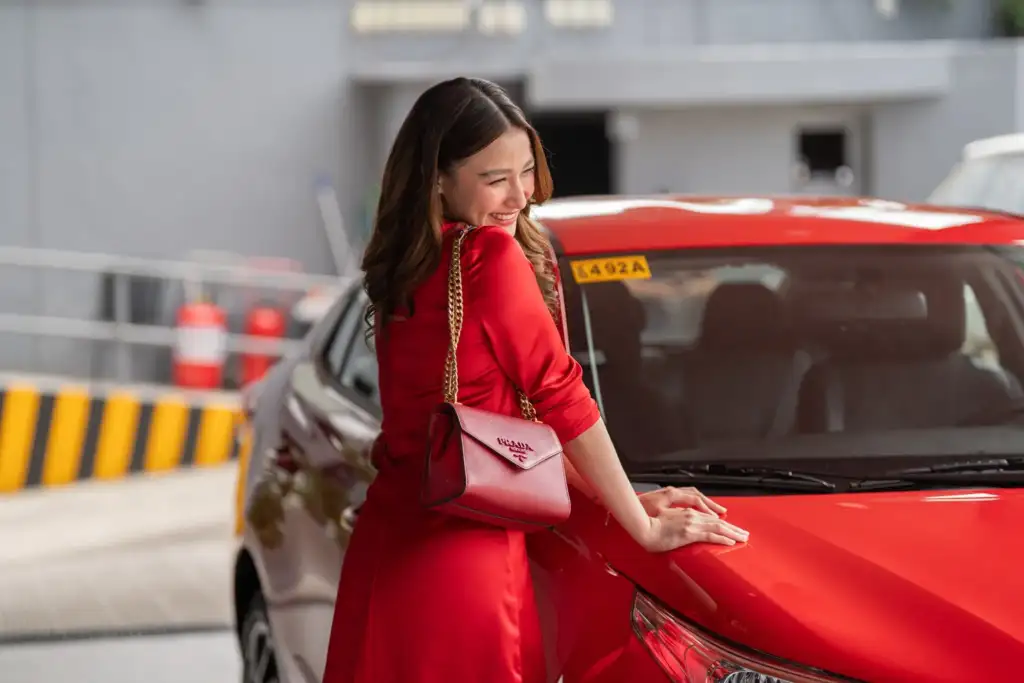 playtime car and model in red dress